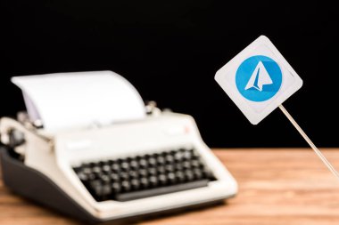 selective focus of telegram app icon with typewriter on background clipart