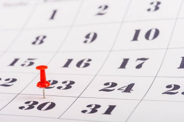 selective focus of red pin on number 30 in calendar clipart