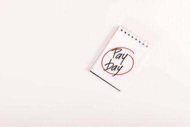top view of notebook with 'pay day' lettering isolated on white clipart
