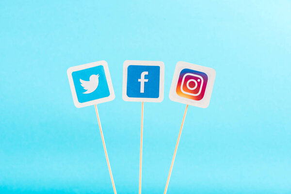 top view of twitter, facebook and instagram icons isolated on blue