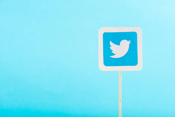 top view of twitter icon isolated on blue with copy space
