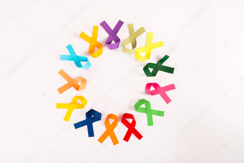 top view of colorful ribbons arranged in circle isolated on white, world cancer day concept 