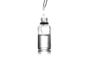 Studio shot of serum bottle and dropper isolated on white clipart