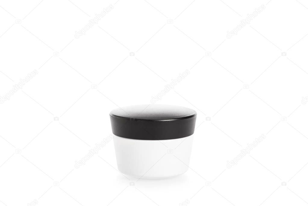 Studio shot of cream container with black cap isolated on white