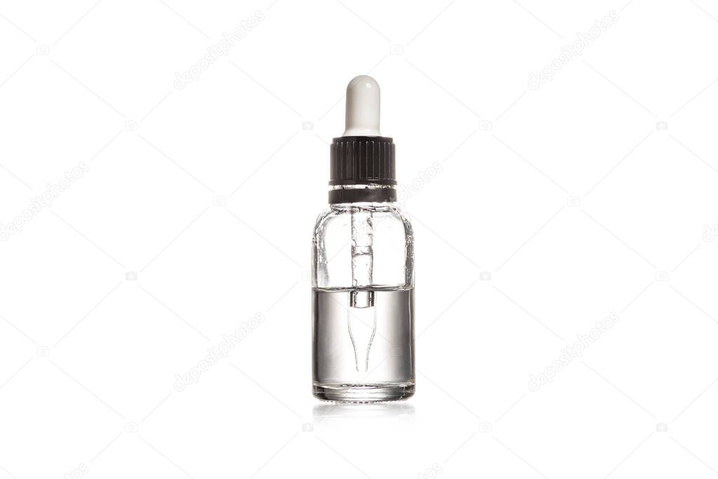 Studio shot of glass bottle with pipette isolated on white