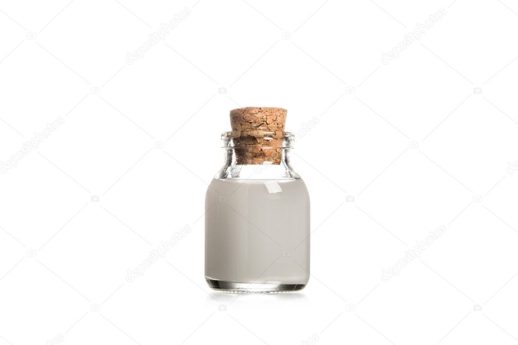 Studio shot of glass bottle with wooden cork isolated on white