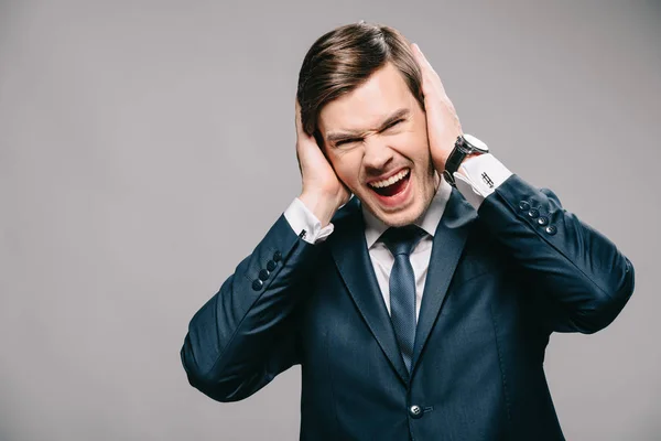 Handsome Businessman Covering Ears Hands Screaming Grey Background — Stock Photo, Image