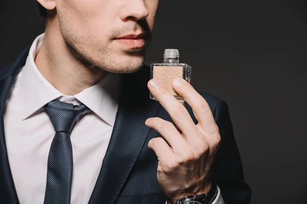 Visão Cortada Empresário Cheiro Perfume Isolado Preto — Fotografia de Stock