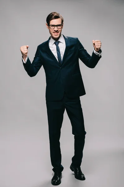 Happy Businessman Celebrating Victory While Standing Grey Background — Stock Photo, Image