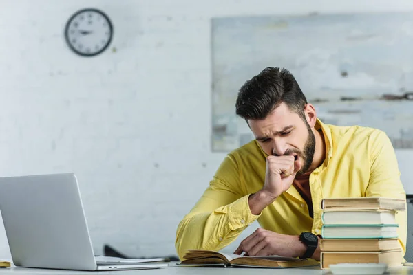 Tired Man Studying Book Yawning Laptop Modern Office — Stock Photo, Image