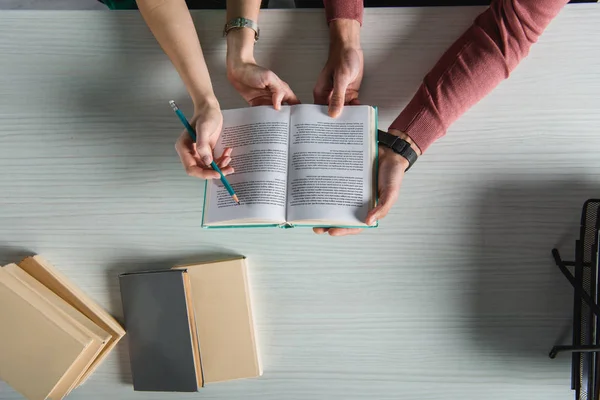 Top View Coworkers Holding Book Hands — Stock Photo, Image