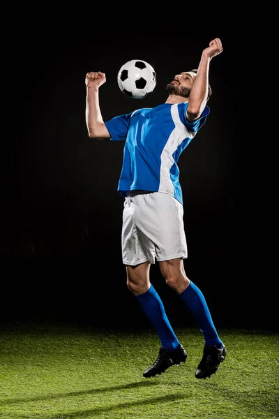 Handsome Football Player Uniform Jumping Ball Isolated Black — Stock Photo, Image