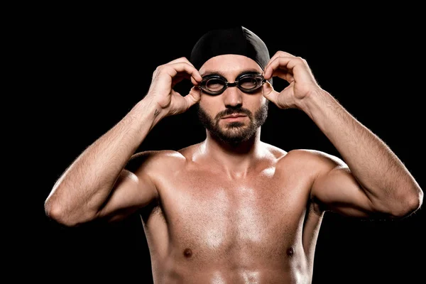 Confident Swimmer Standing Swimming Cap Touching Goggles Isolated Black — Stock Photo, Image