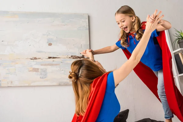 Smiling Daughter Mother Red Cloaks Playing Home — Stock Photo, Image