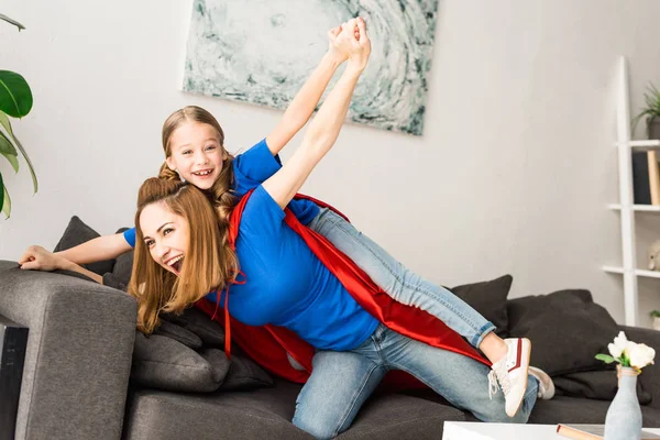 Smiling Mother Daughter Red Cloaks Playing Home — Stock Photo, Image