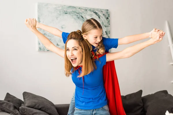Smiling Mother Daughter Red Cloaks Playing Home — Stock Photo, Image