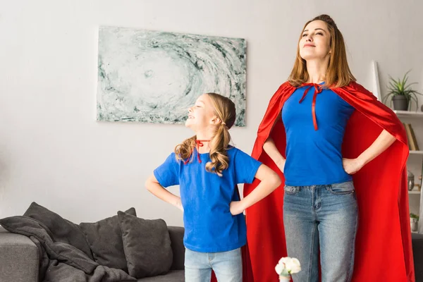 Mother Daughter Red Cloaks Looking Away — Stock Photo, Image