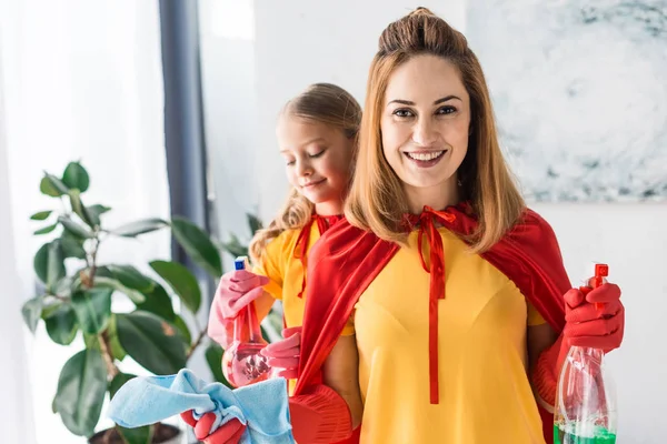 Mother Daughter Red Capes Rubber Gloves Cleaning Home — Stock Photo, Image