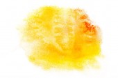 pohled shora žluté a oranžové akvarel skvrny na bílém papíře 