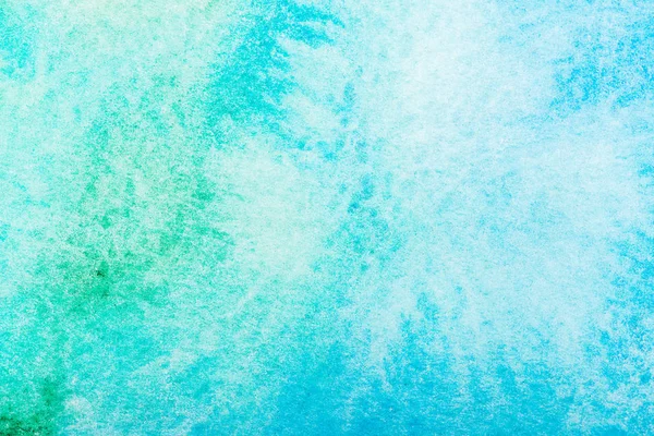 top view of turquoise watercolor spill with copy space 