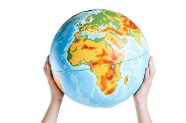 partial view of child holding globe in raised hands isolated on white, earth day concept clipart