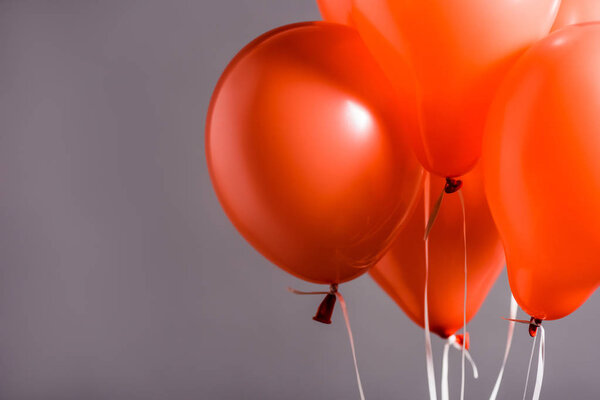 coral air balloons on grey background, color of 2019 concept