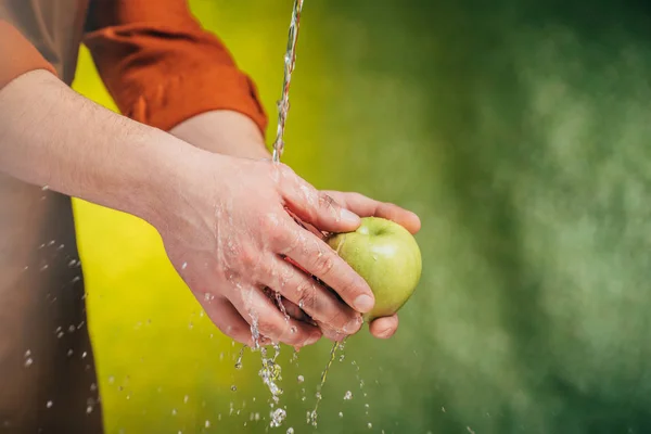 Partial View Man Washing Apple Blowing Water Blurred Background Earth — Stock Photo, Image