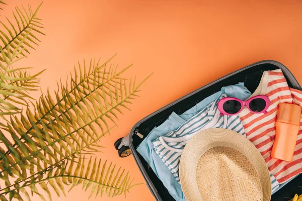 Top View Suitcase Summer Accessories Sunscreen Orange Background Palm Leaves — Stock Photo, Image