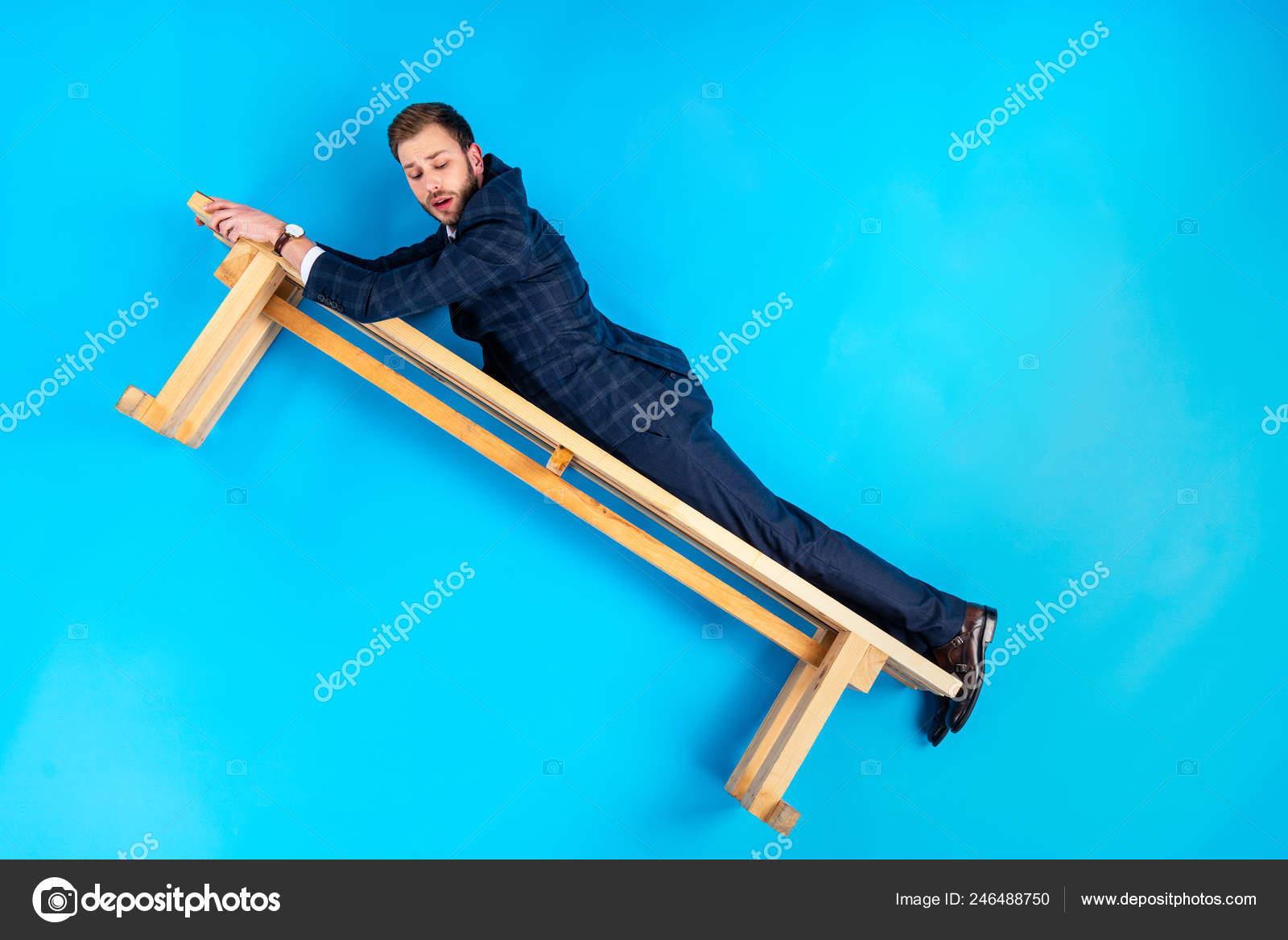 Man Suit Lying Wooden Bench Blue Background Stock Photo by