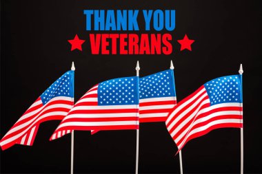 american flags with thank you veterans lettering isolated on black clipart
