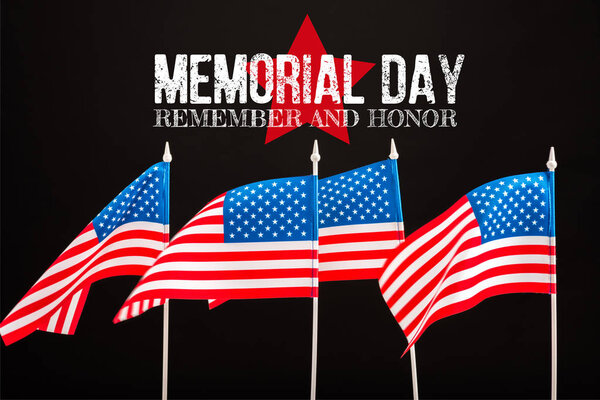 american flags with memorial day lettering isolated on black
