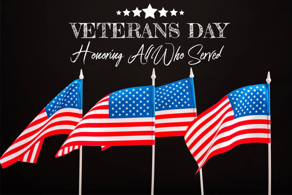 american flags with veterans day lettering isolated on black