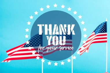 american flags with thank you for your service lettering on blue clipart