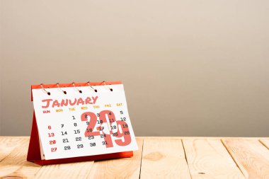 calendar with January 2019 lettering isolated on beige with copy space clipart