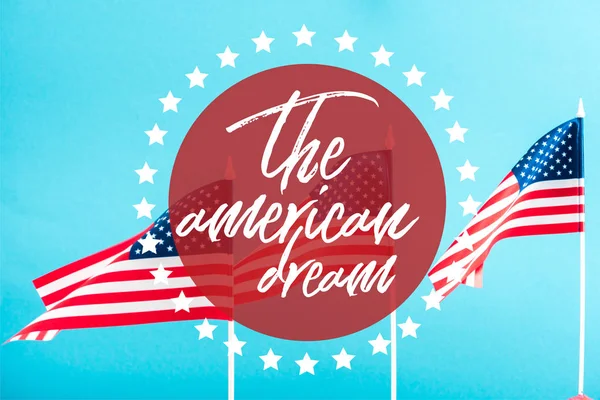american flags with the american dream lettering in circle with stars around on blue