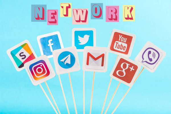 social media icons and network multicolored lettering isolated on blue