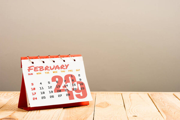 calendar with February 2019 lettering isolated on beige with copy space