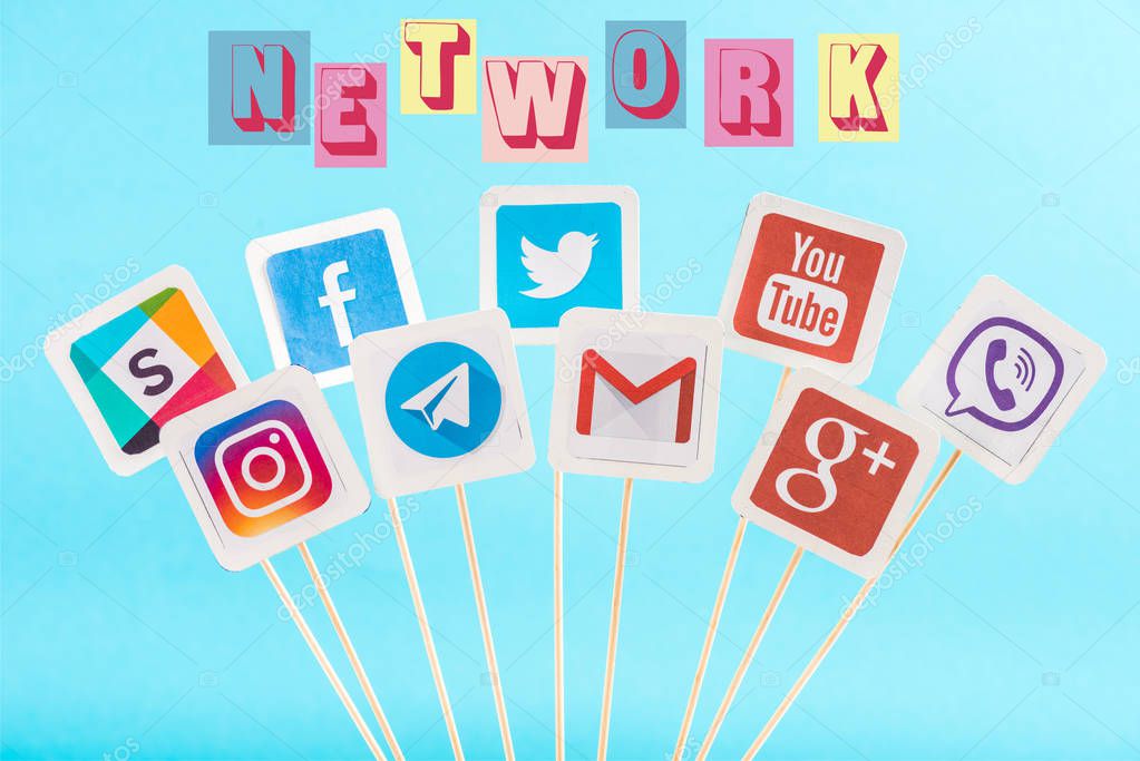 Social media icons and network multicolored lettering isolated on blue