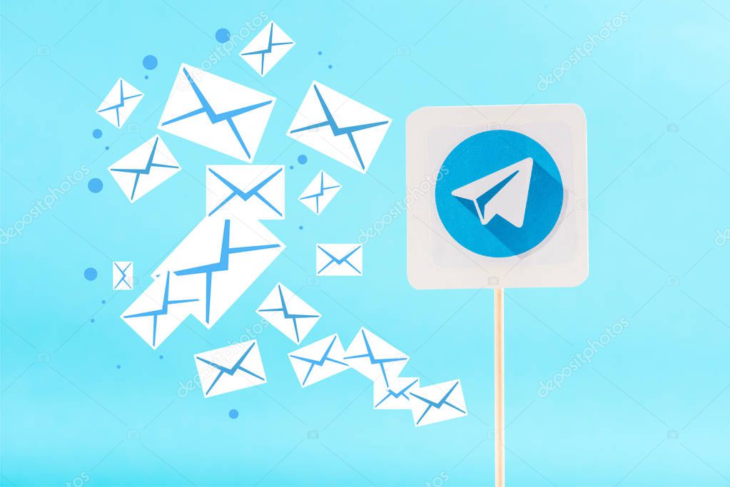 Card with telegram logo and e-mail icons isolated on blue