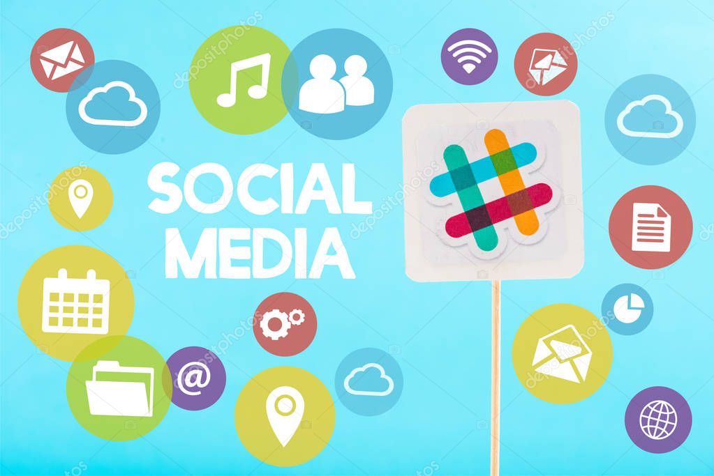Card with slack logo, social media lettering and multicolored icons isolated on blue