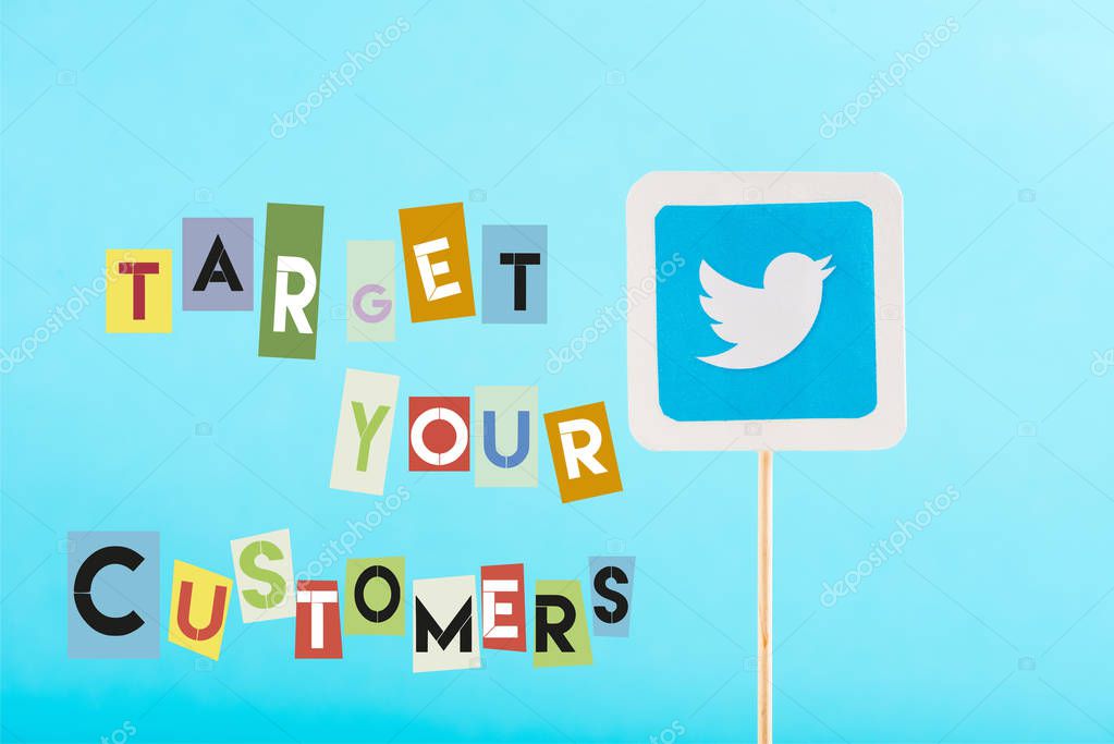 Card with twitter logo and target your customers lettering isolated on blue