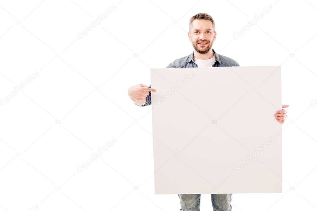 front view of smiling bearded man holding blank placard isolated on white
