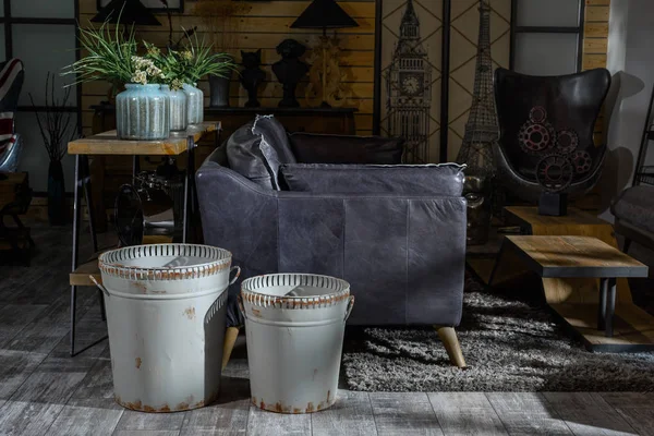 Interior of modern retro styled living room with grey armchair and trash cans — Stock Photo