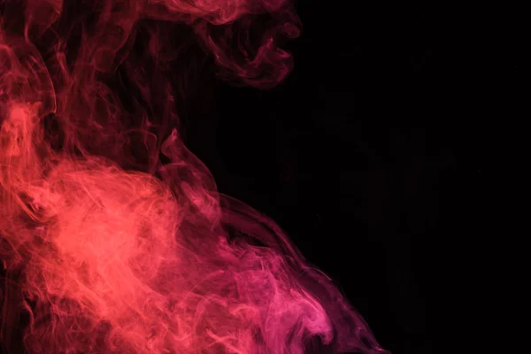 Red smoke on black background with copy space — Stock Photo