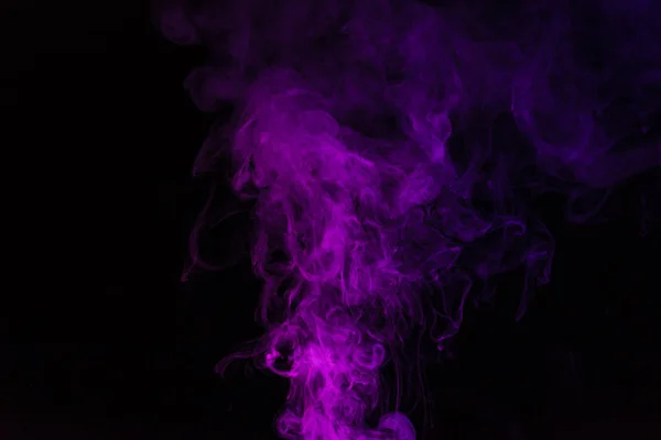 Spiritual pink smoky swirl on black background — Stock Photo
