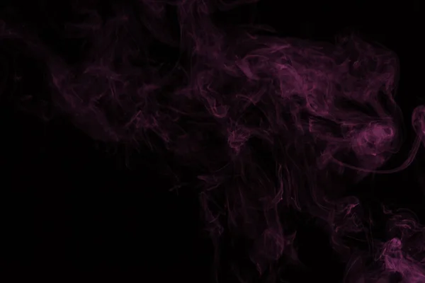 Mystical pink smoke on black background — Stock Photo