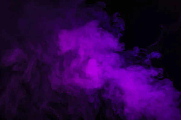 Purple spiritual smoke on black background — Stock Photo