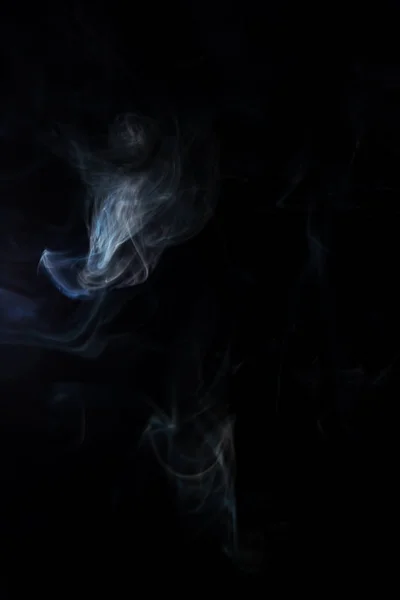 White spiritual smoke on black background — Stock Photo