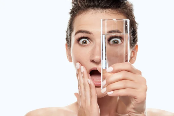 Naked girl holding glass of pure water, isolated on white — Stock Photo