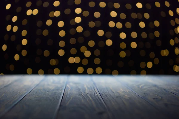 Empty wooden planks surface and shiny golden bokeh background — Stock Photo